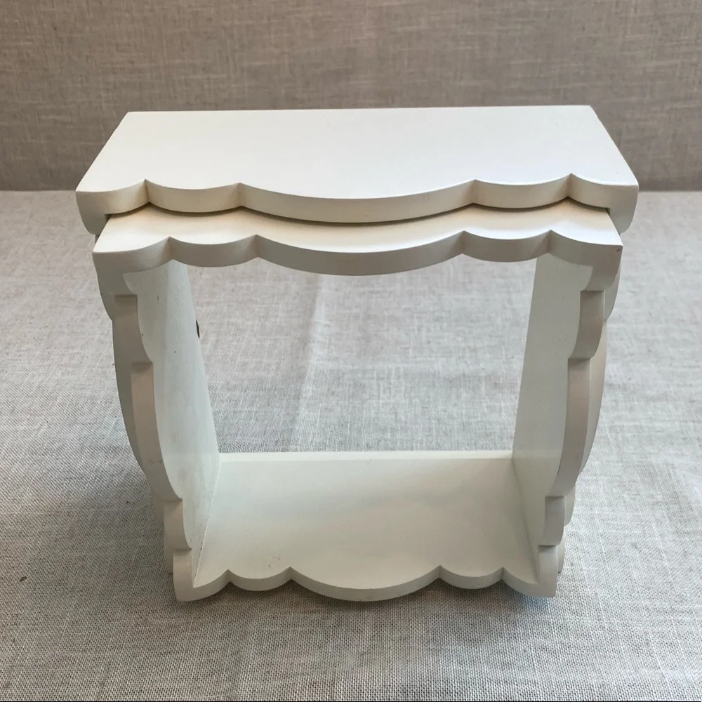 Two wall hanging white shadow boxes.